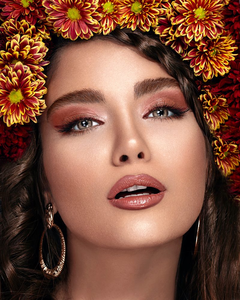 Crop gorgeous woman with makeup and floral wreath